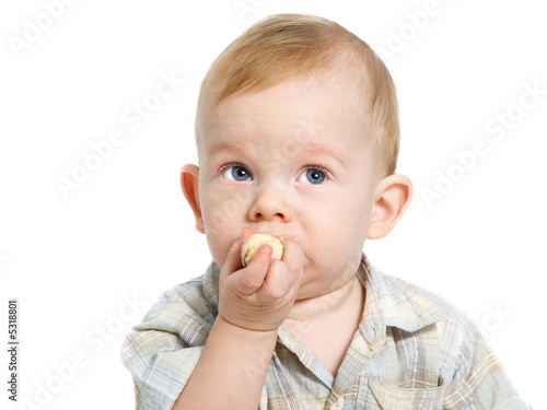 Boy eating banana