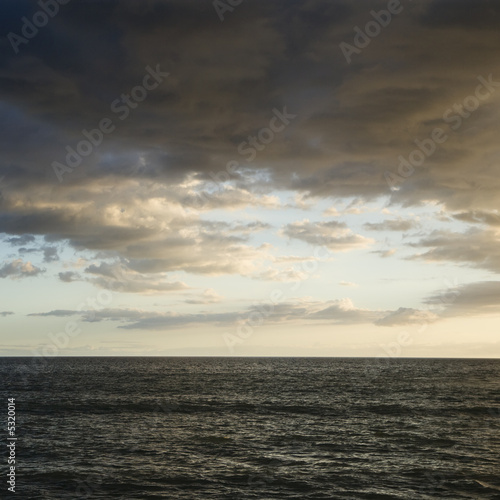 Pacific ocean and cloudy sky in Maui, Hawaii.