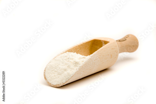 Wooden spoon with flour