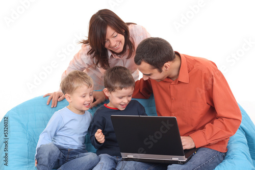 family using laptop