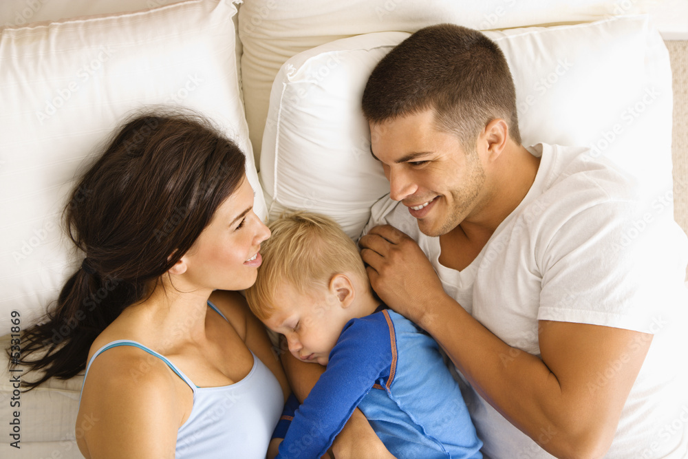 Family in bed.