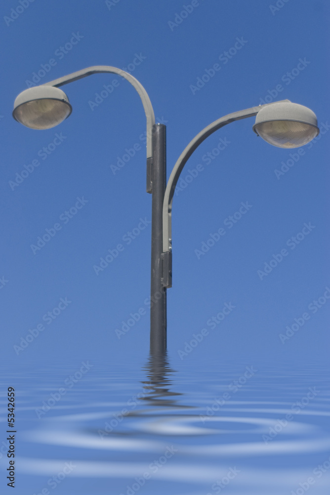 two grey street lamppost drower in blue sky two grey street lamppost drower in blue sky