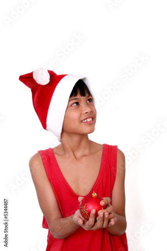 little santa claus with bauble photo