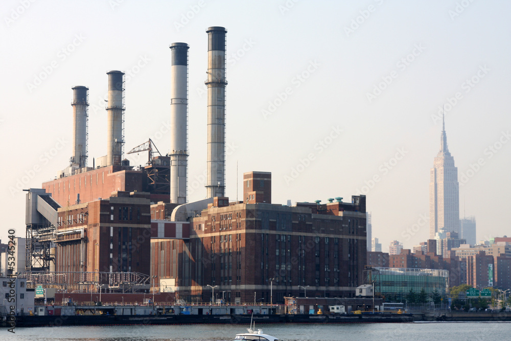 power plant with nyc buildings in background