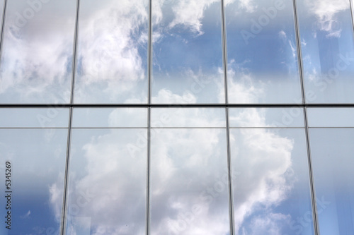 cloud reflections on glass office building