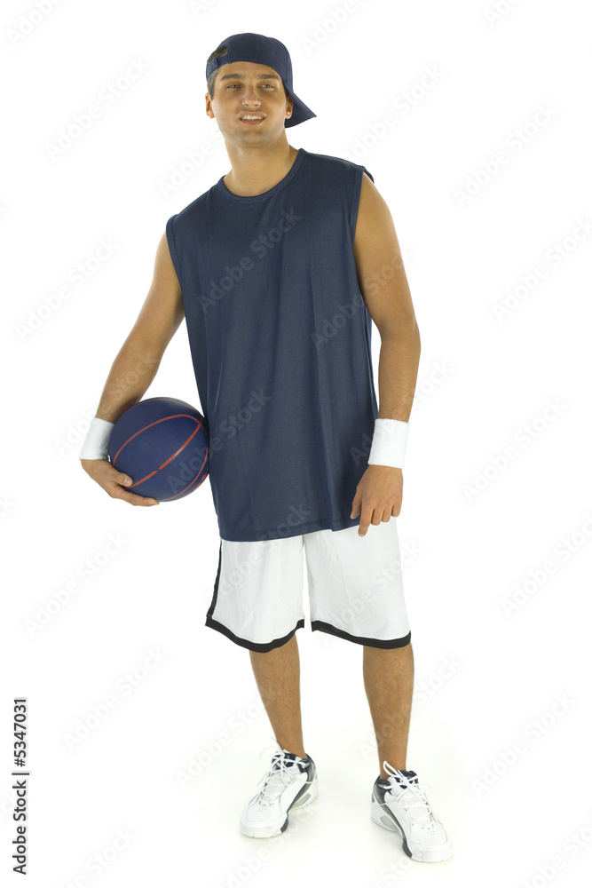 Young man holding basketball in hands Young man holding basketball in hands