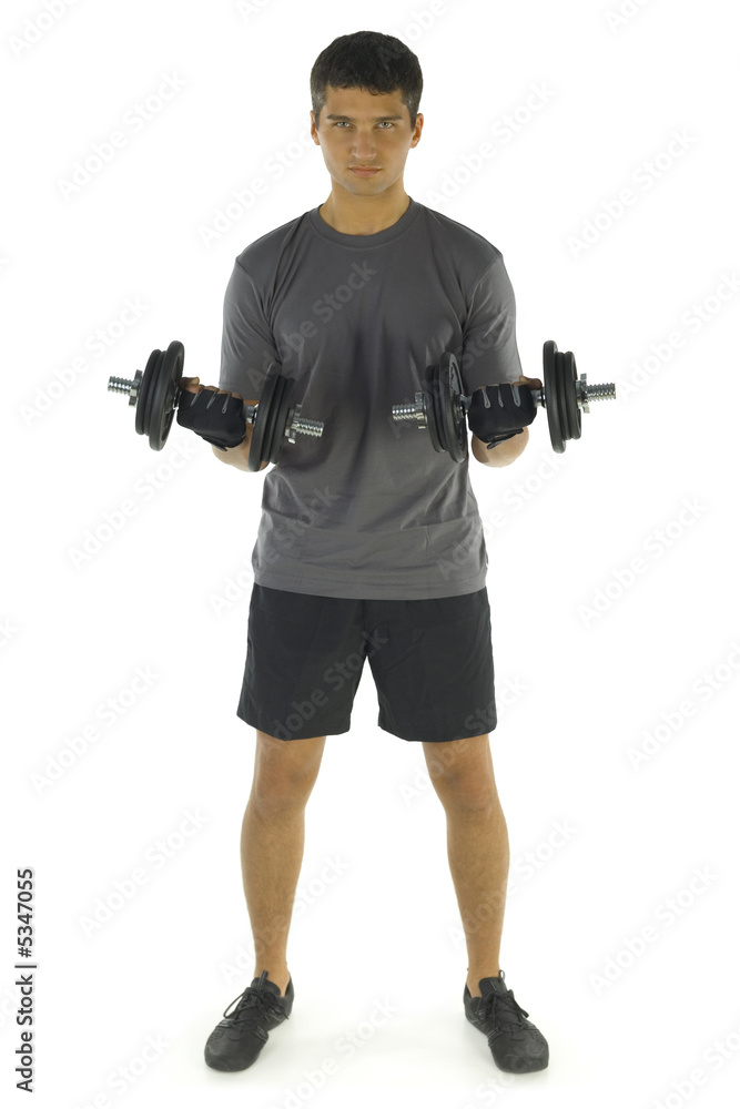 Young man exercising arms muscles with dumbbells Young man exercising arms muscles with dumbbells