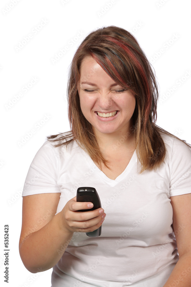 Young model giggling at remote control for tv Young model giggling at remote control for tv