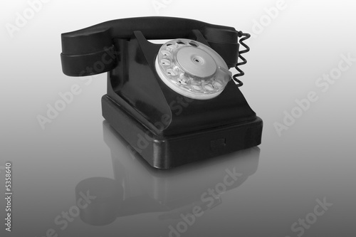 old black telephone with reflection