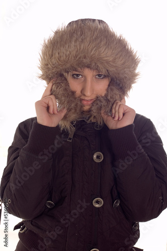 Young girl wearning winter jacket with hood photo