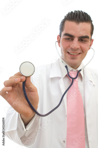 young doctor listening to heart beats with his stethescope