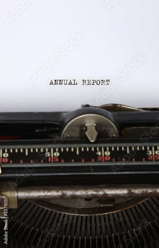 Close up of an antique typewriter with the words Annual report 