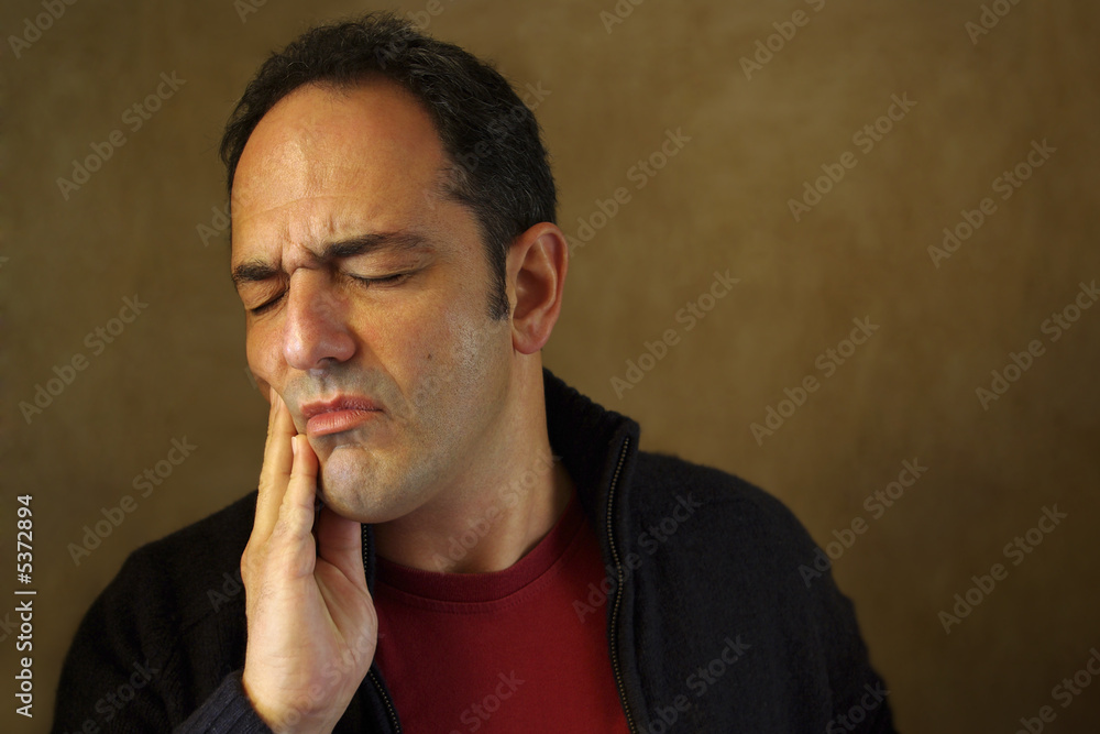 Portrait of a man in painfull expression with a toothache. Portrait of a man in painfull expression with a toothache.