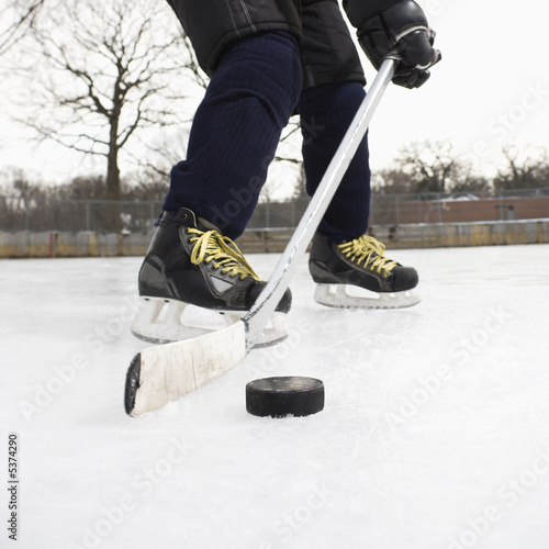 Photography Boy playing ice hockey.