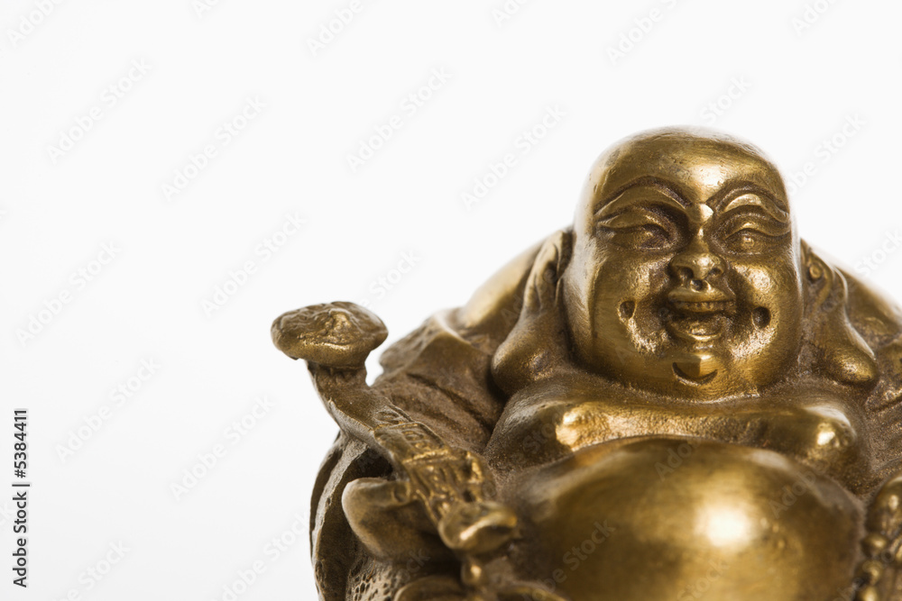 Happy laughing Buddha brass figurine on white background.