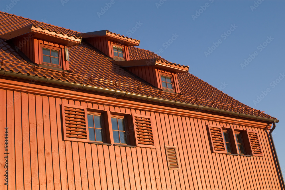 fragment of an old wooden house in sunset light