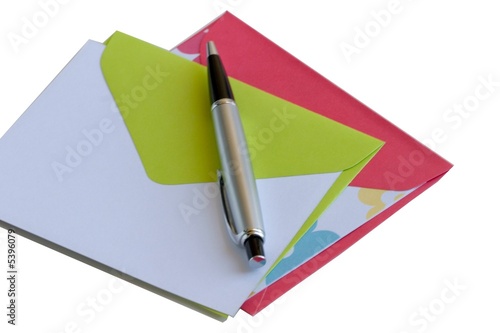 Two note cards with matching envelopes and a pen