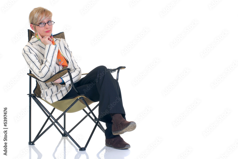 Attractive blond young businesswoman in director chair, Attractive blond young businesswoman in director chair,