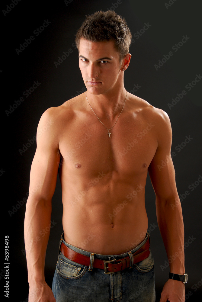 Fototapeta premium A handsome young man with no shirt on