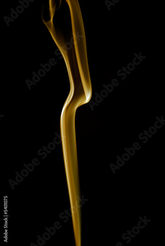 yellow ray of smoke abstract in black background