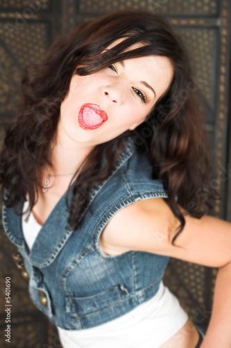 Slika na platnu Young adult brunette woman with a white top and brown hair