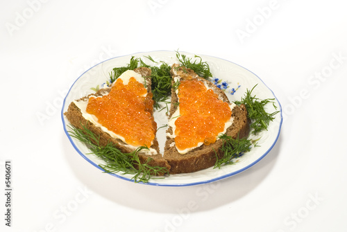 Sandwiches with red caviar on the plate