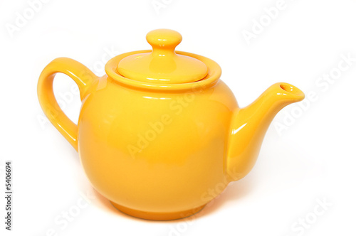 Yellow tea pot isolated on white