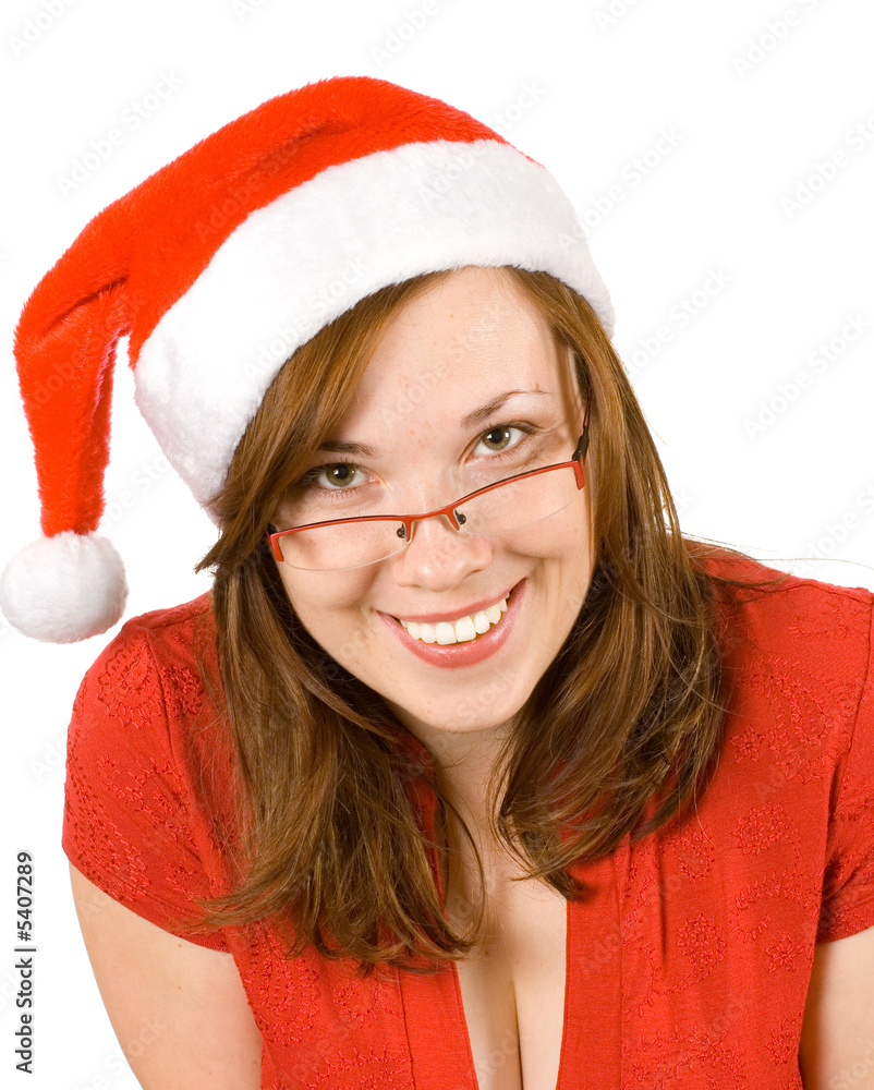 Young smiling girl with santa hat and red specs Young smiling girl with santa hat and red specs
