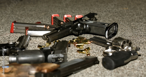 four pistols and one revolver, magazine and bullets