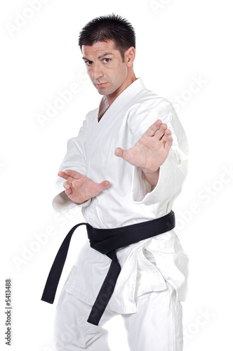 Black belt karate expert with fight stance