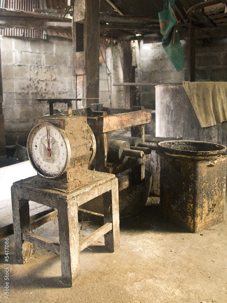 Interior of old factory with a scale on a table