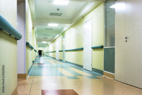 long corridor in hospital with doors and reflections photo