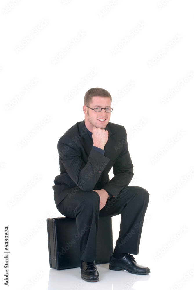 Handsome successful young businessman, sitting Handsome successful young businessman, sitting