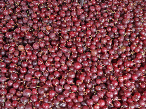Red gooseberries in a market, close-up