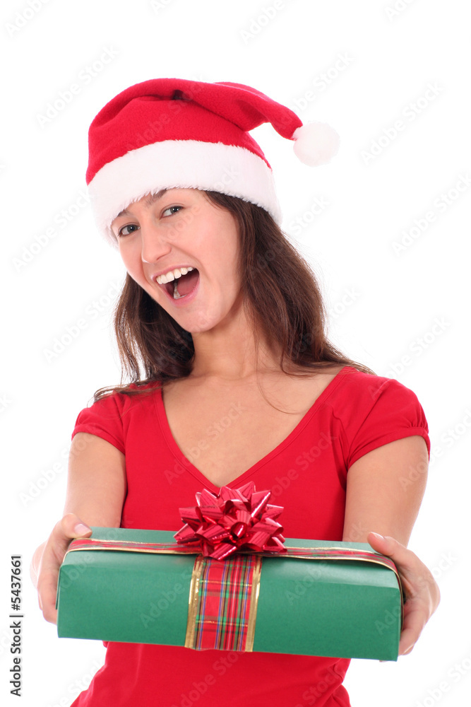 Young woman wearing Santa hat, holding present Young woman wearing Santa hat, holding present