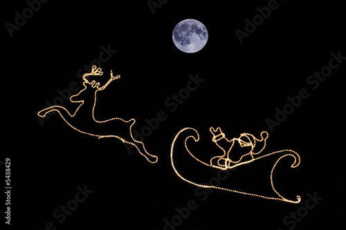Santa and moon in the sky
