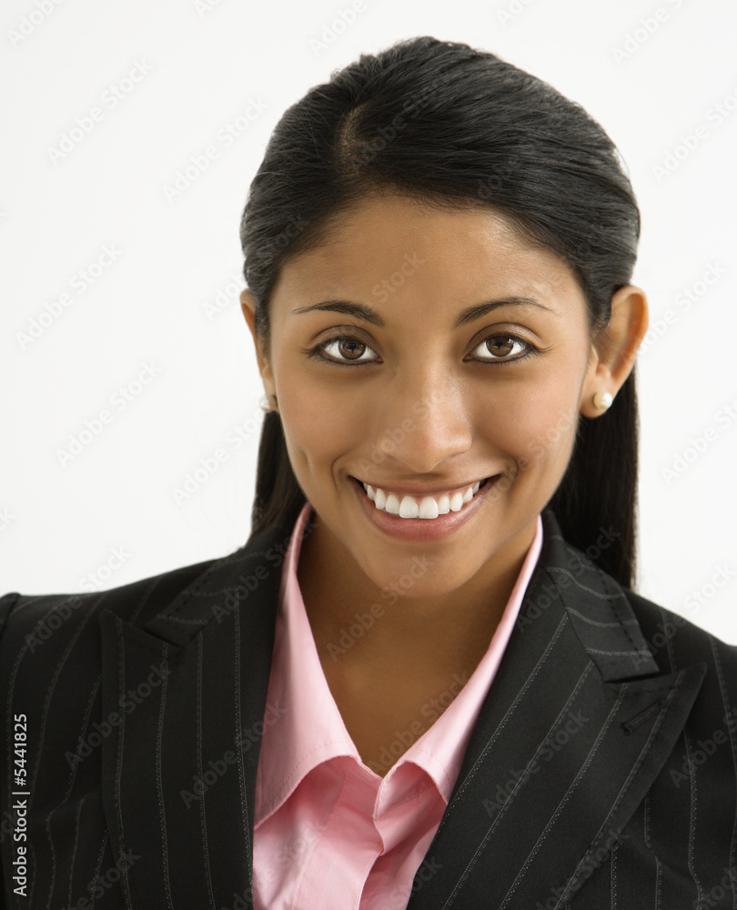 Portrait of smiling businesswoman against white background. Portrait of smiling businesswoman against white background.