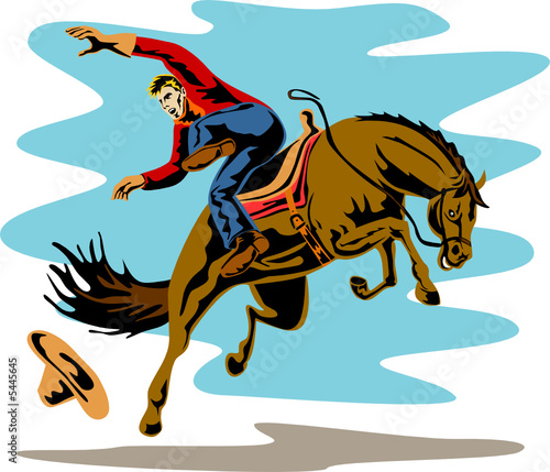 Rodeo cowboy riding a bucking bronco