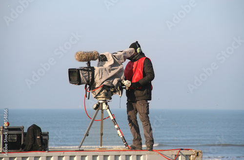TV camera man filming a sports match