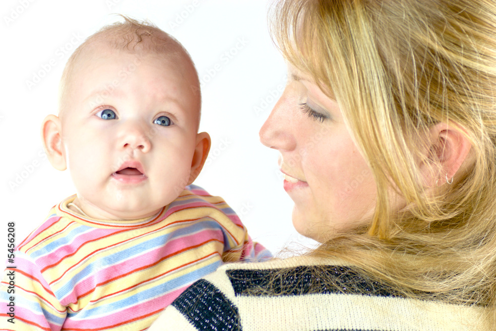 mother holding her baby both wearing stripped closes mother holding her baby both wearing stripped closes