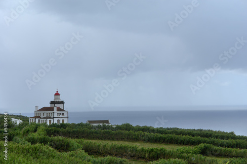 old lighthouse at the coast in azores island