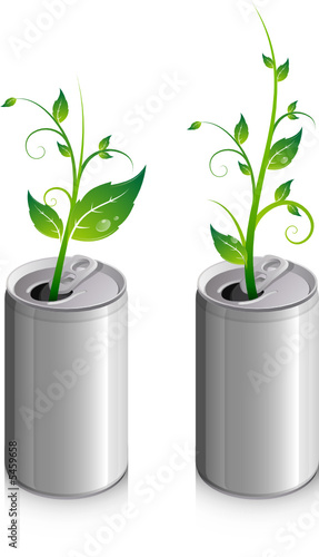 Canette de soda avec jeune plante qui pousse