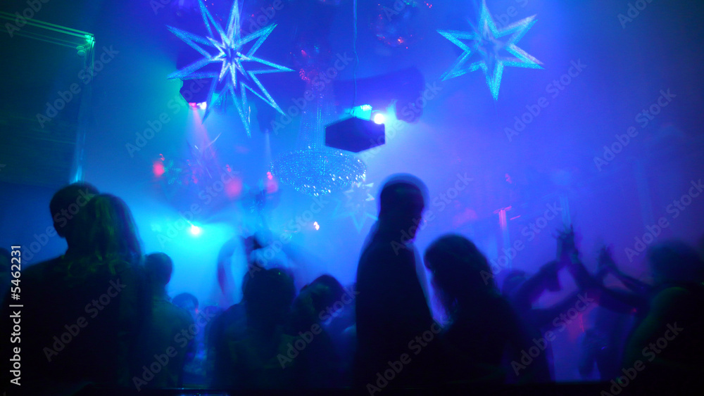 Nightclub scene with christmas decor and dance floor crowd Nightclub scene with christmas decor and dance floor crowd