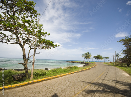 barren empty beach with road malecon corn island nicaragua