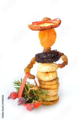Doll made from dried fruit. Traditional Christmas decoration.
