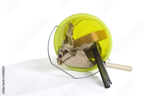 a green bucket with window-cleaning stuff photo