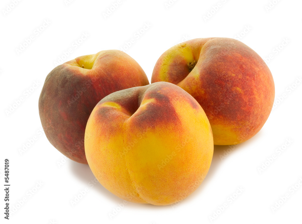 three full peaches isolated on white background three full peaches isolated on white background