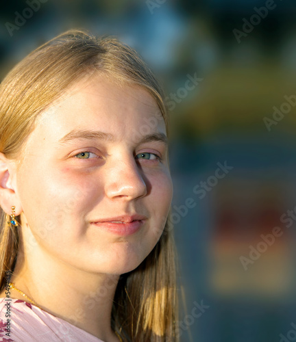 image of a teenage girl with amused smile