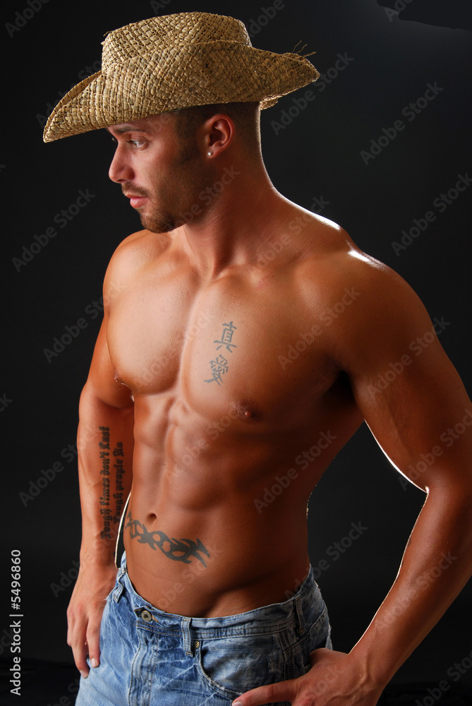 A msucular cowboy without a shirt A msucular cowboy without a shirt