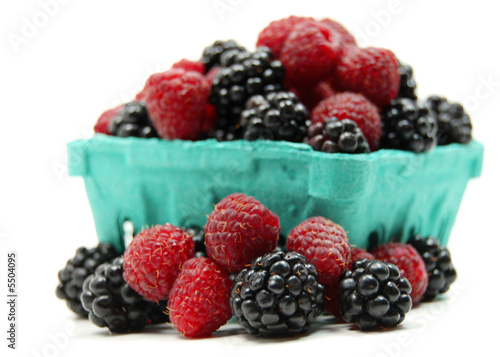 a mixed pint of organic blackberries and raspberries